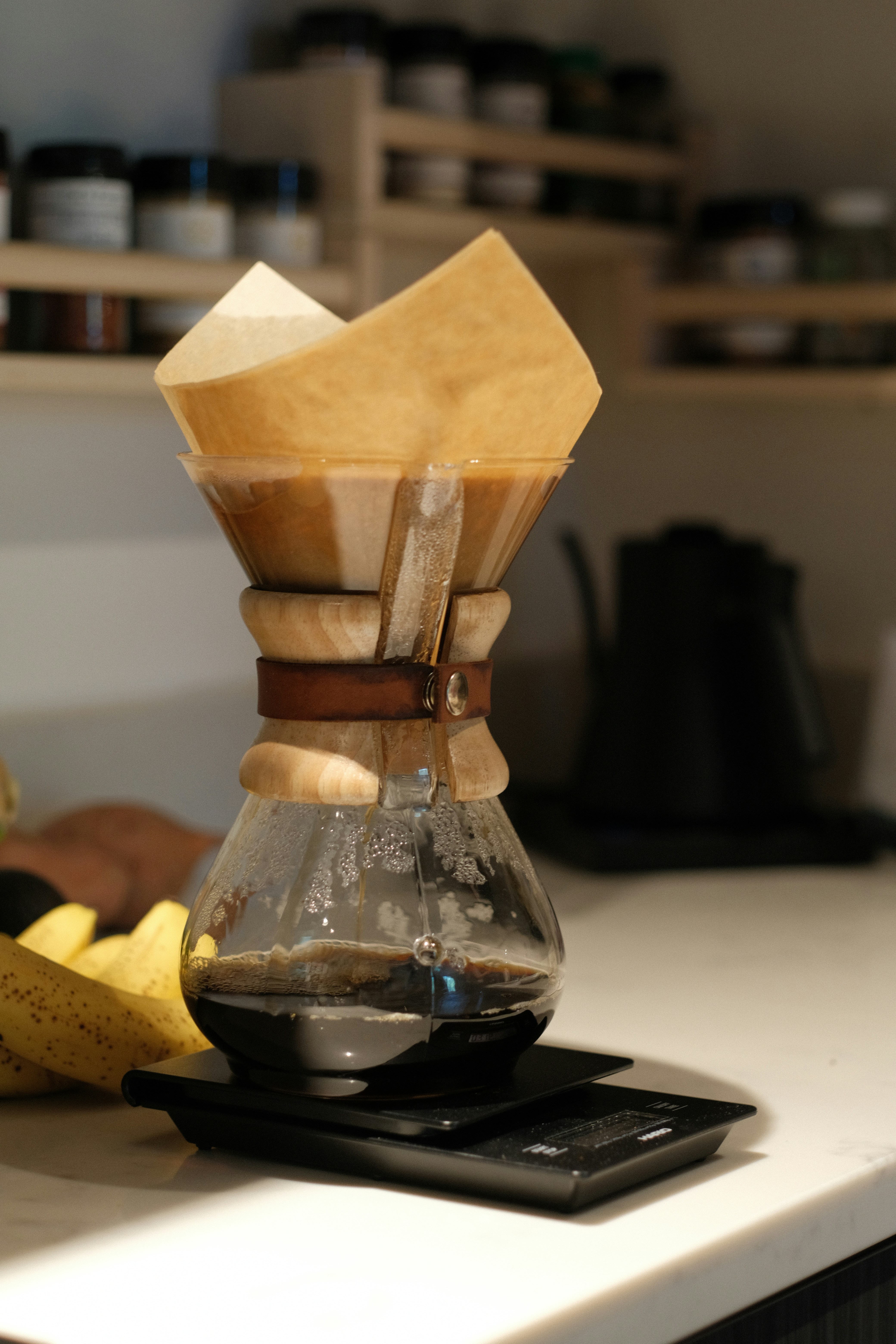 Coffee brewing in a chemex on a scale.