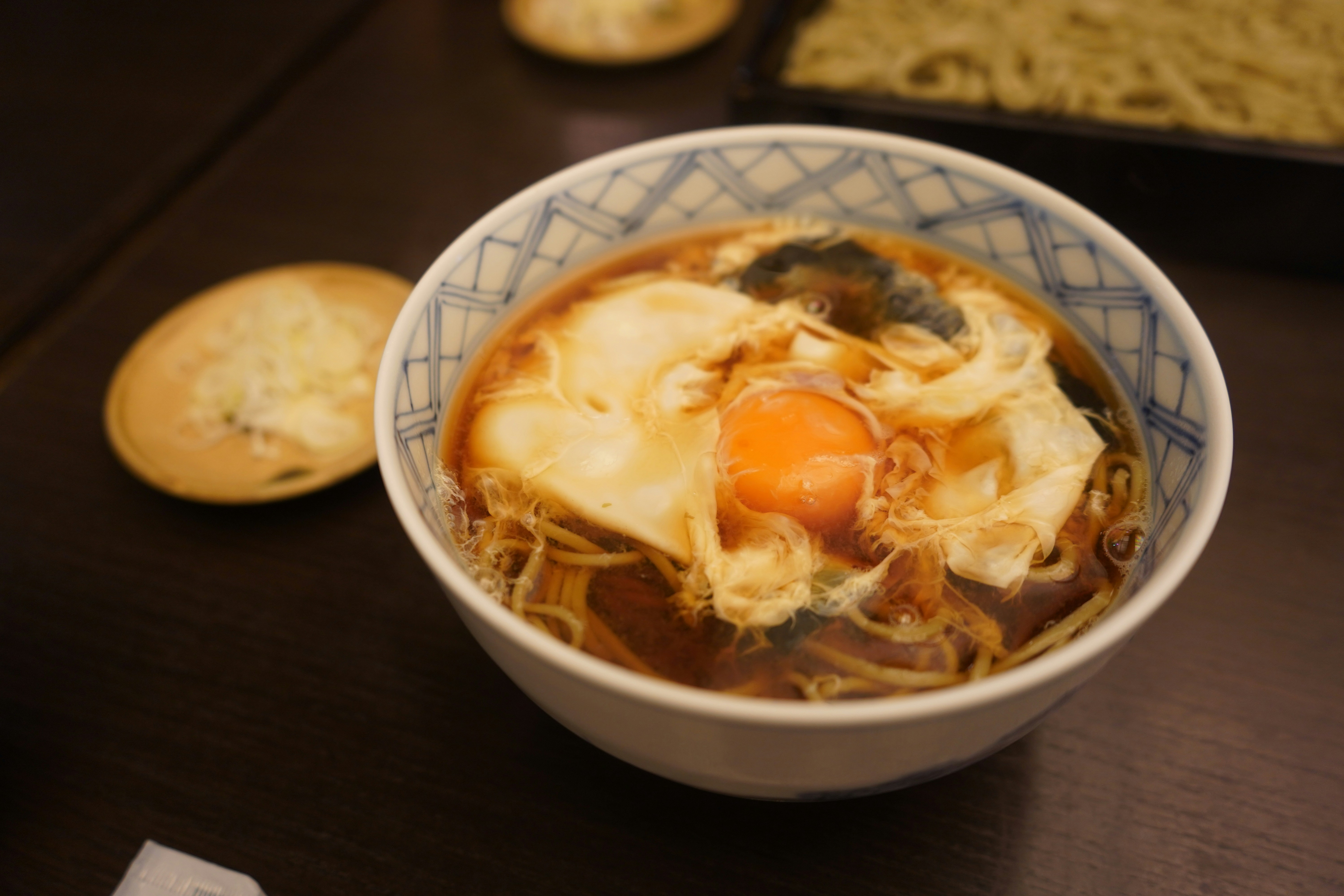 Bowl of noodles with egg and other ingredients