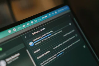Macbook screen shows macos software update downloading