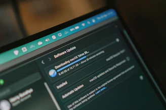 Macbook screen shows macos software update downloading