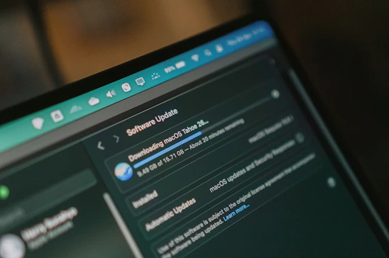 Macbook screen shows macos software update downloading