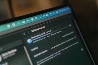 Macbook screen shows macos software update downloading