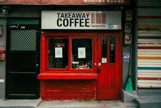 Small takeaway coffee shop with red facade