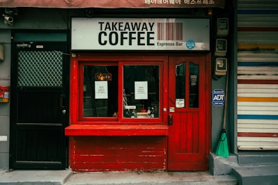 Small takeaway coffee shop with red facade