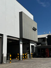 Modern industrial building exterior with loading docks.