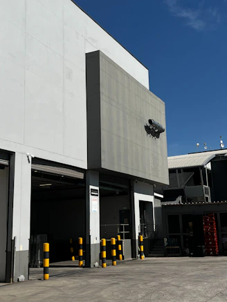 Modern industrial building exterior with loading docks.