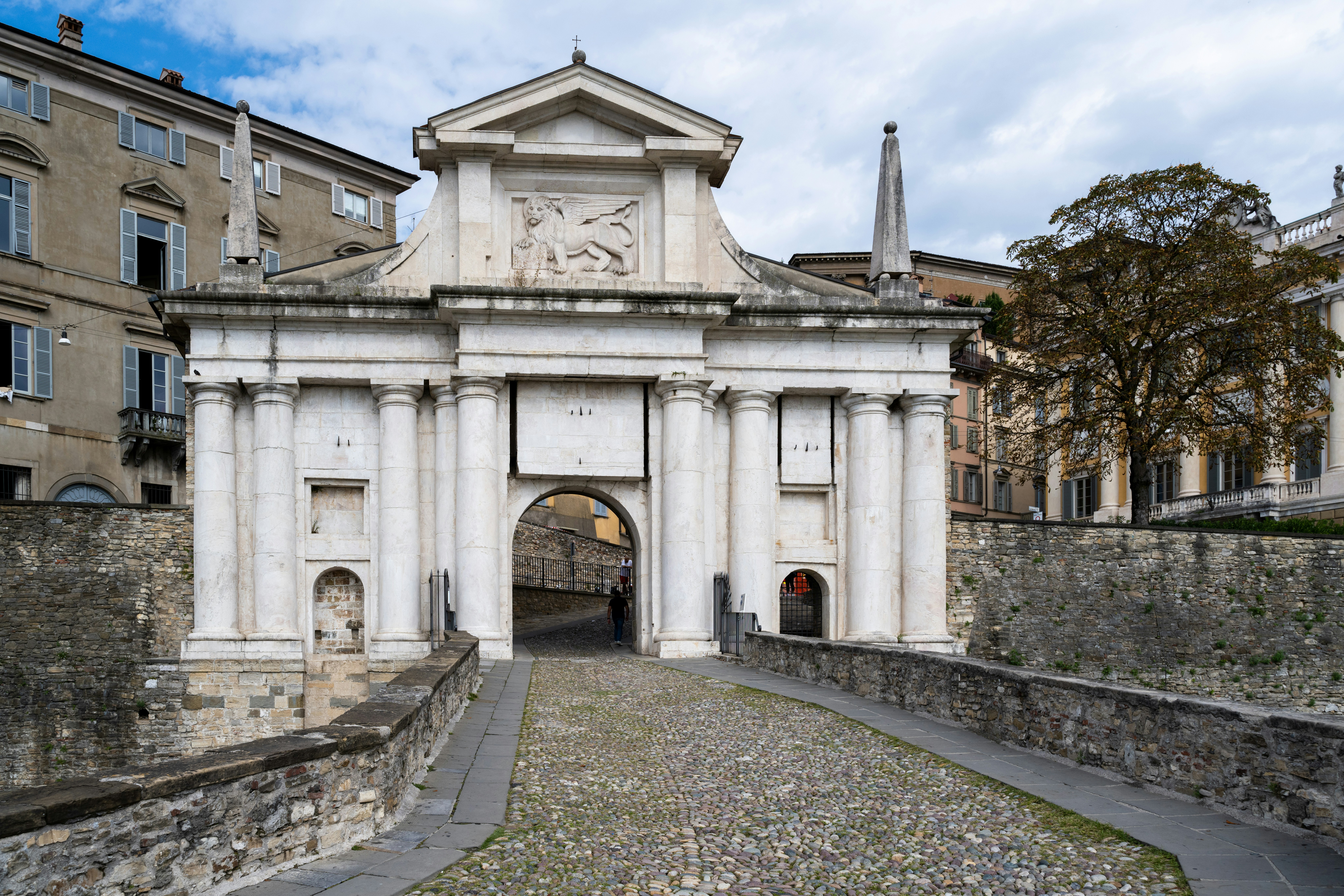 Ancient stone gatehouse with arched entrance and bridge