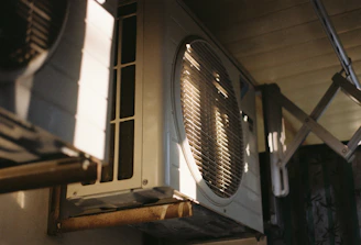 Close-up of an air conditioning unit on a sunny day.