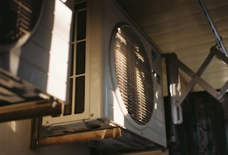 Close-up of an air conditioning unit on a sunny day.