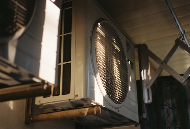 Close-up of an air conditioning unit on a sunny day.