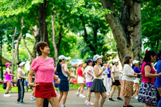 Group of women exercising together in a park