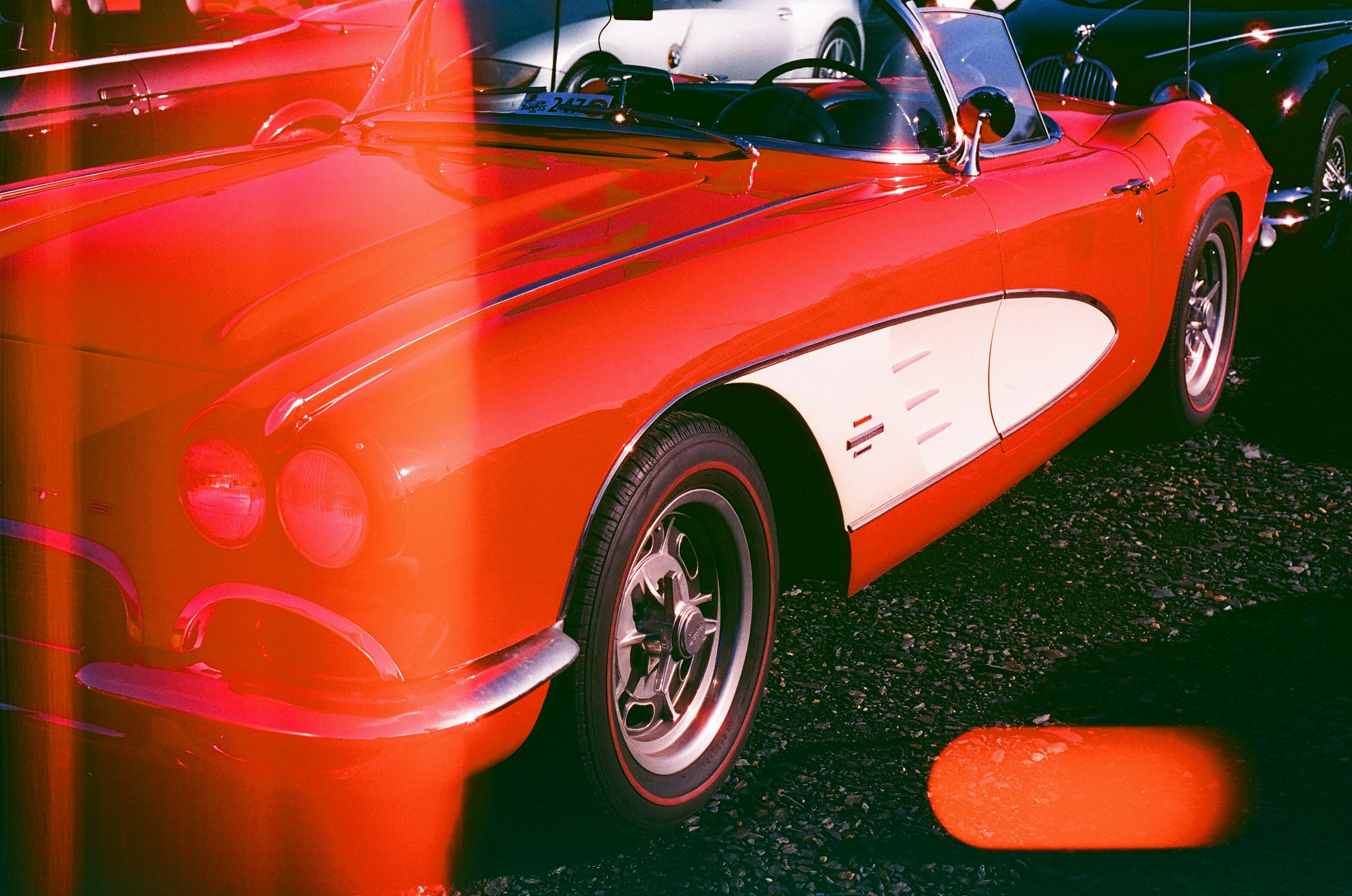 Vintage red convertible car with white accents
