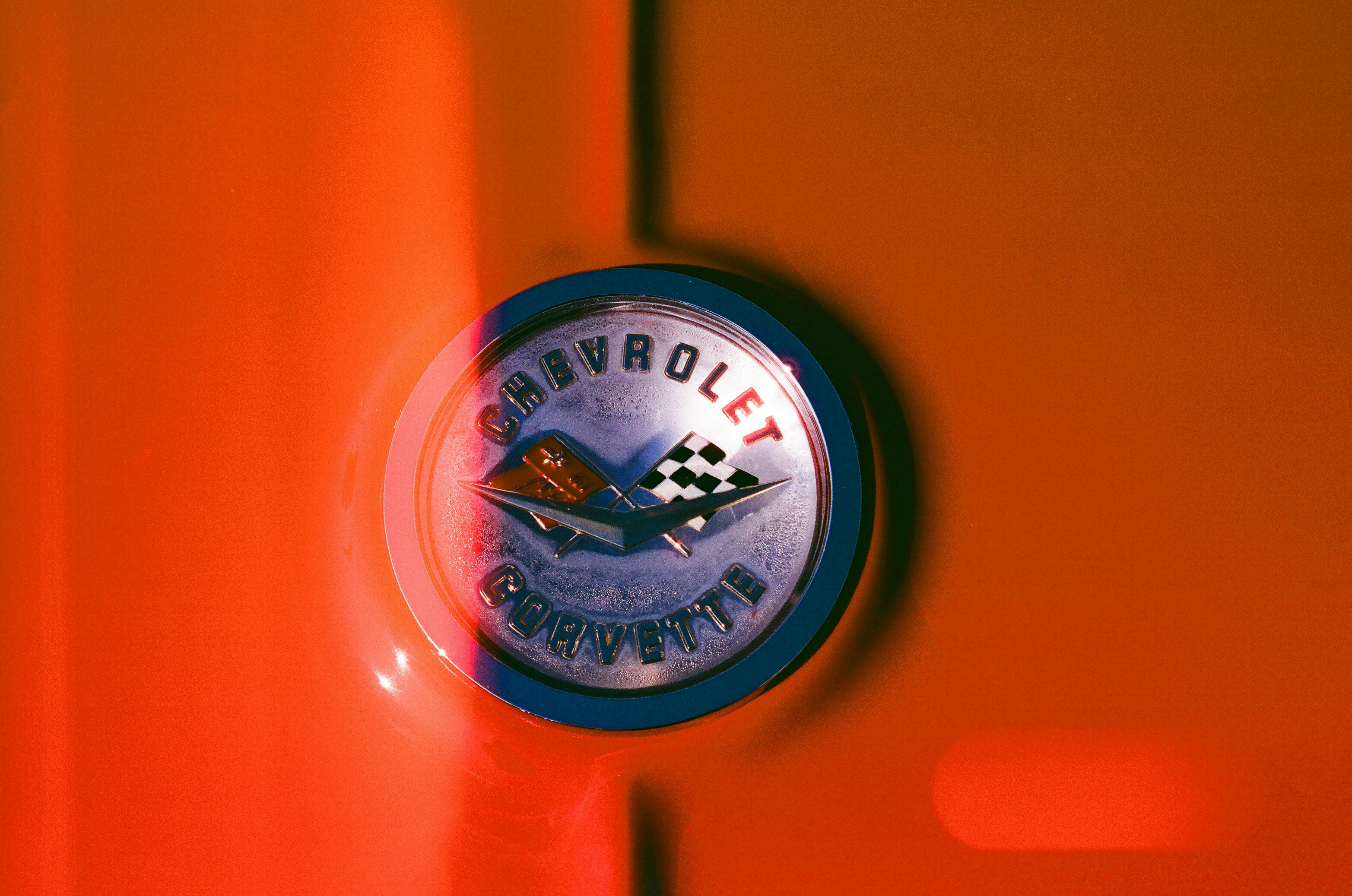 Chevrolet corvette emblem on orange background