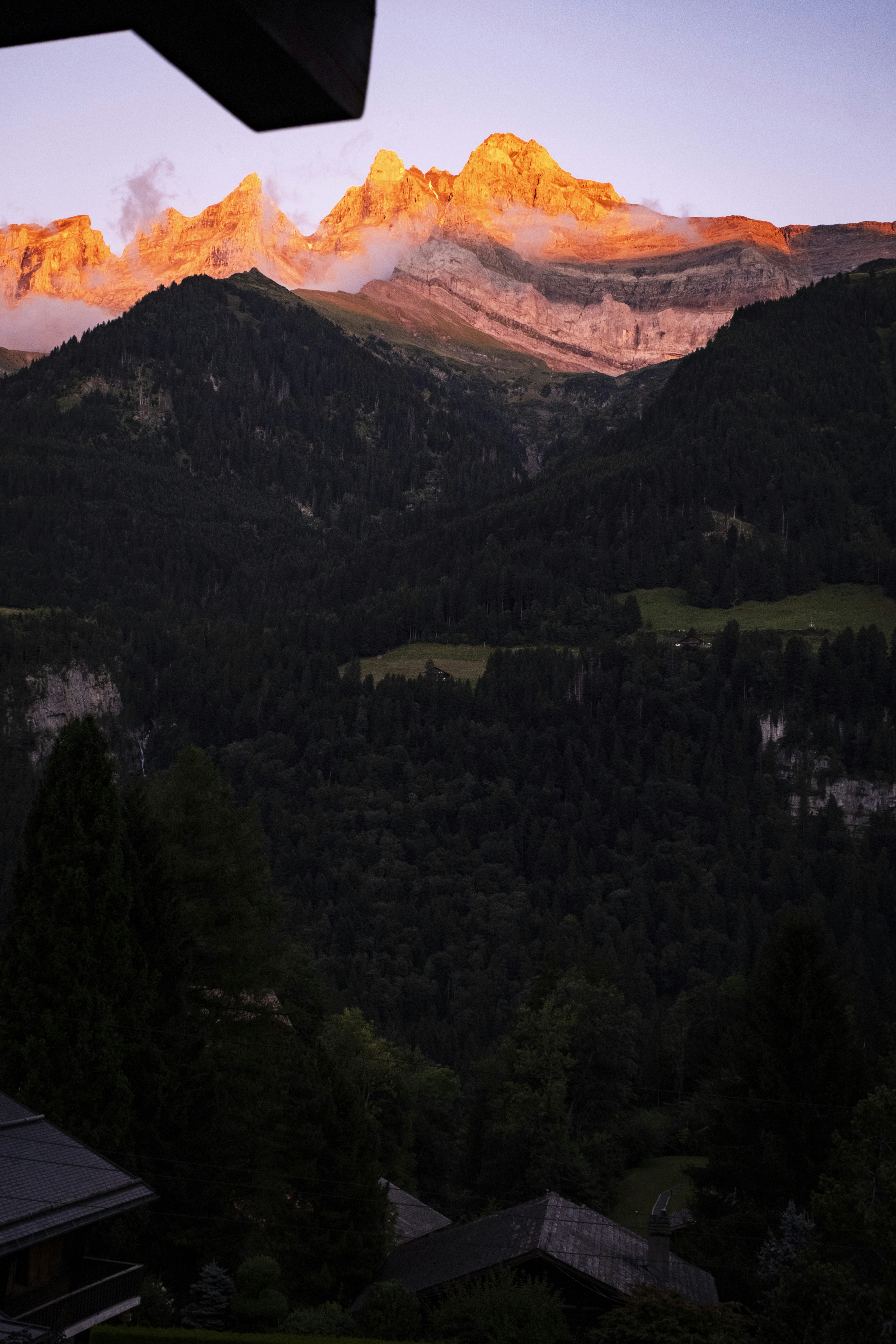 Golden mountain peaks illuminated by the setting sun.