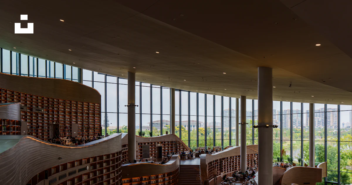 Modern library interior with tall windows and bookshelves photo – Free ...