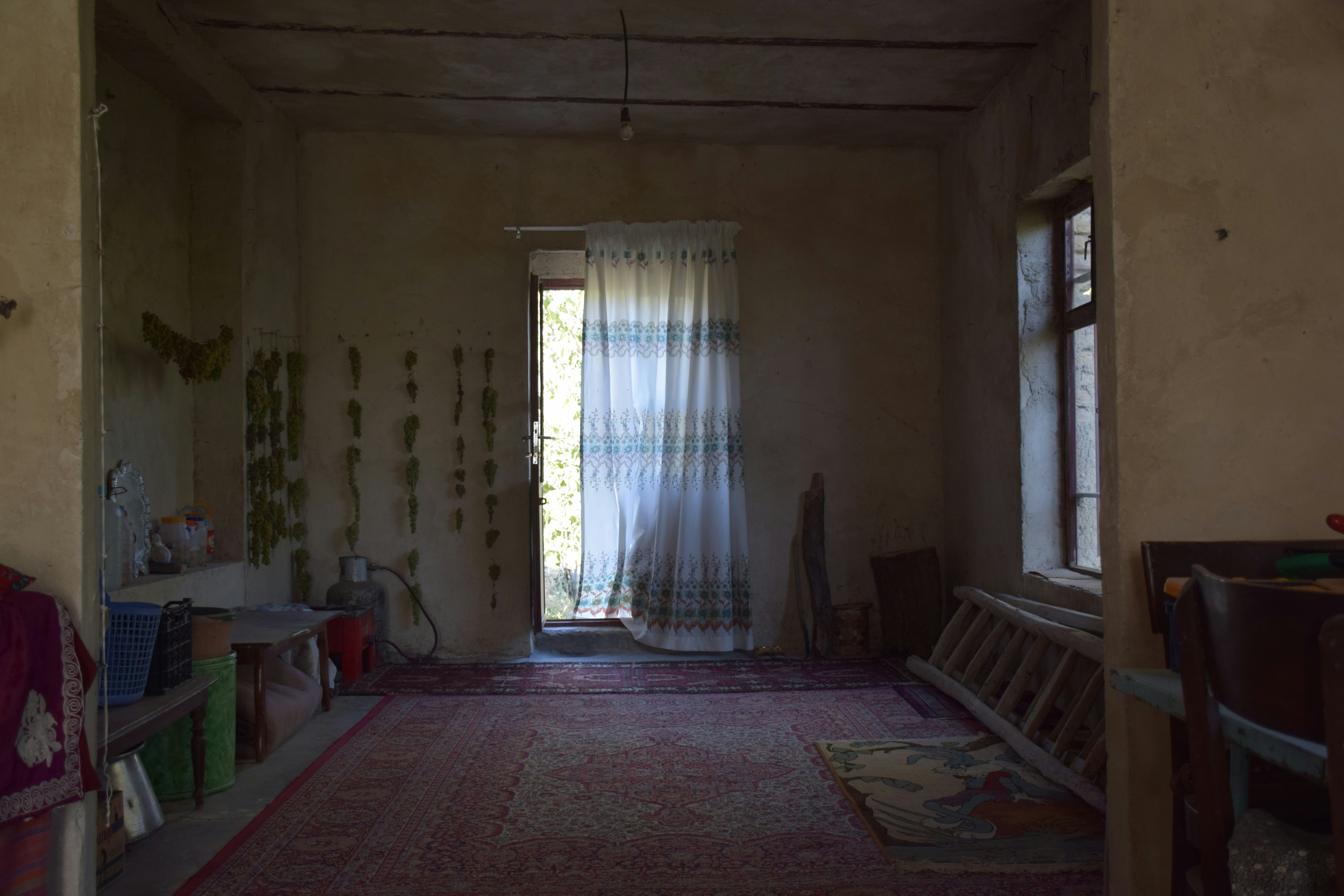 Interior of a rustic room with a ladder