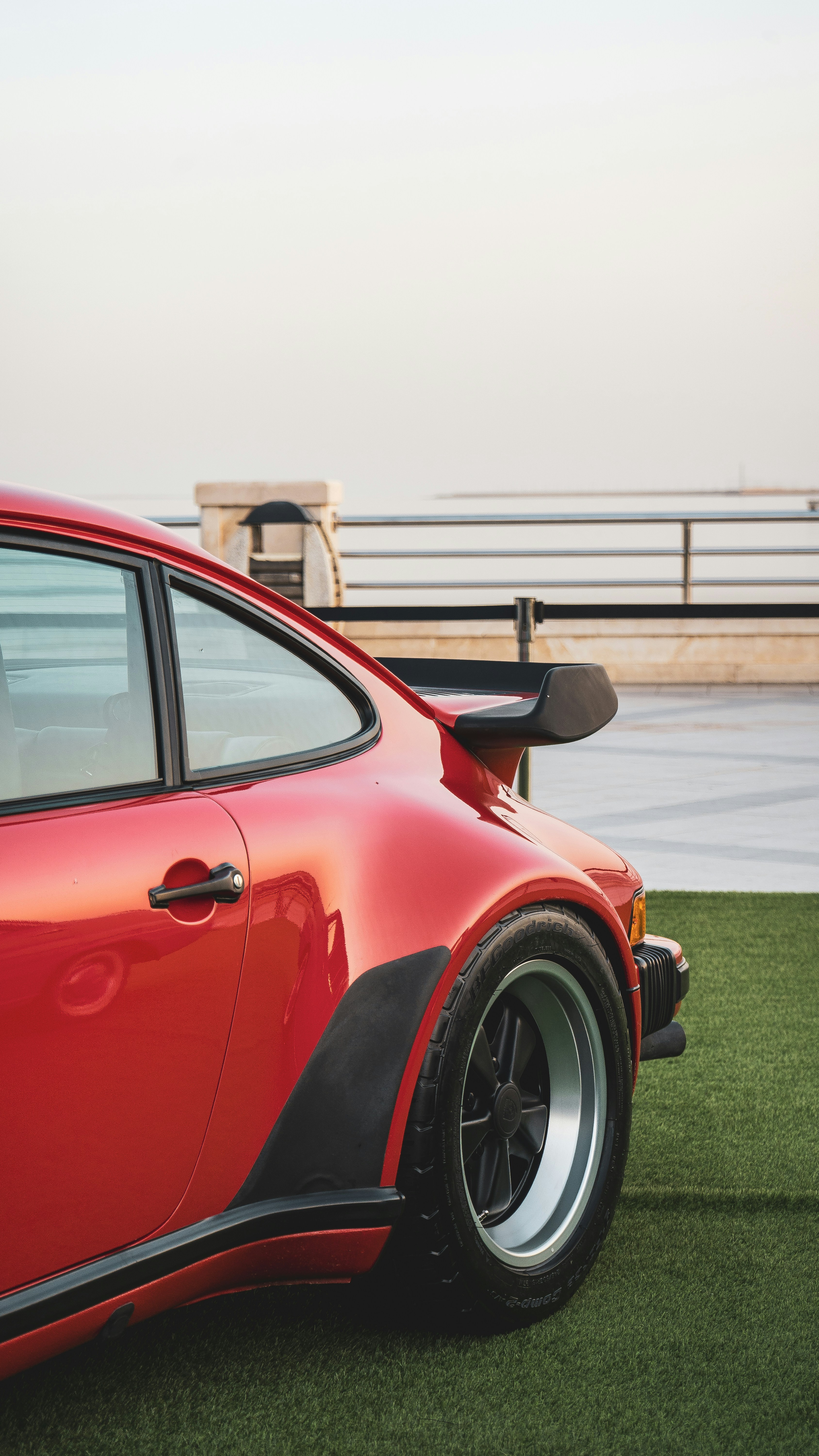 Red vintage sports car with a large spoiler