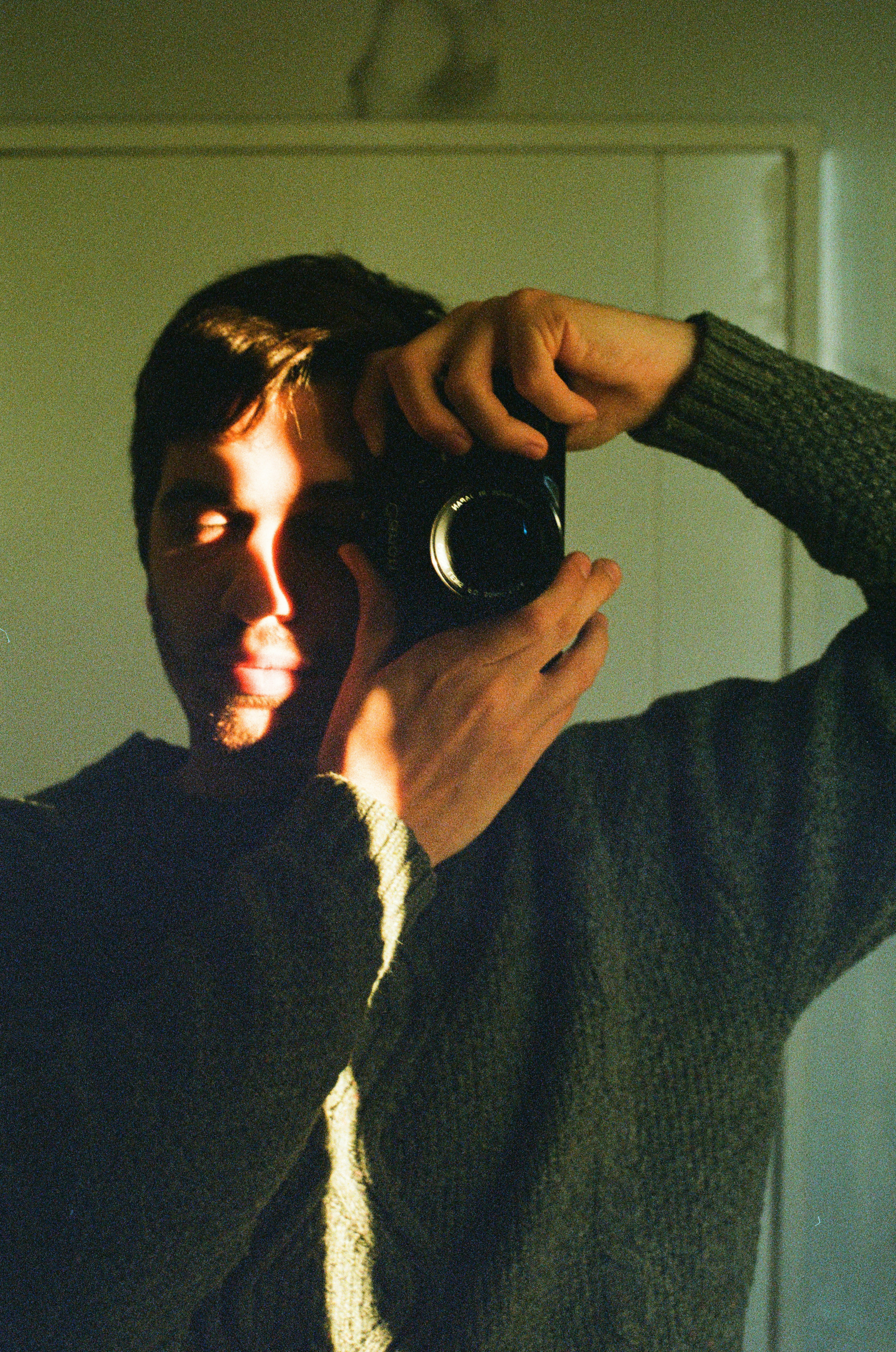 Man taking a selfie with a camera.