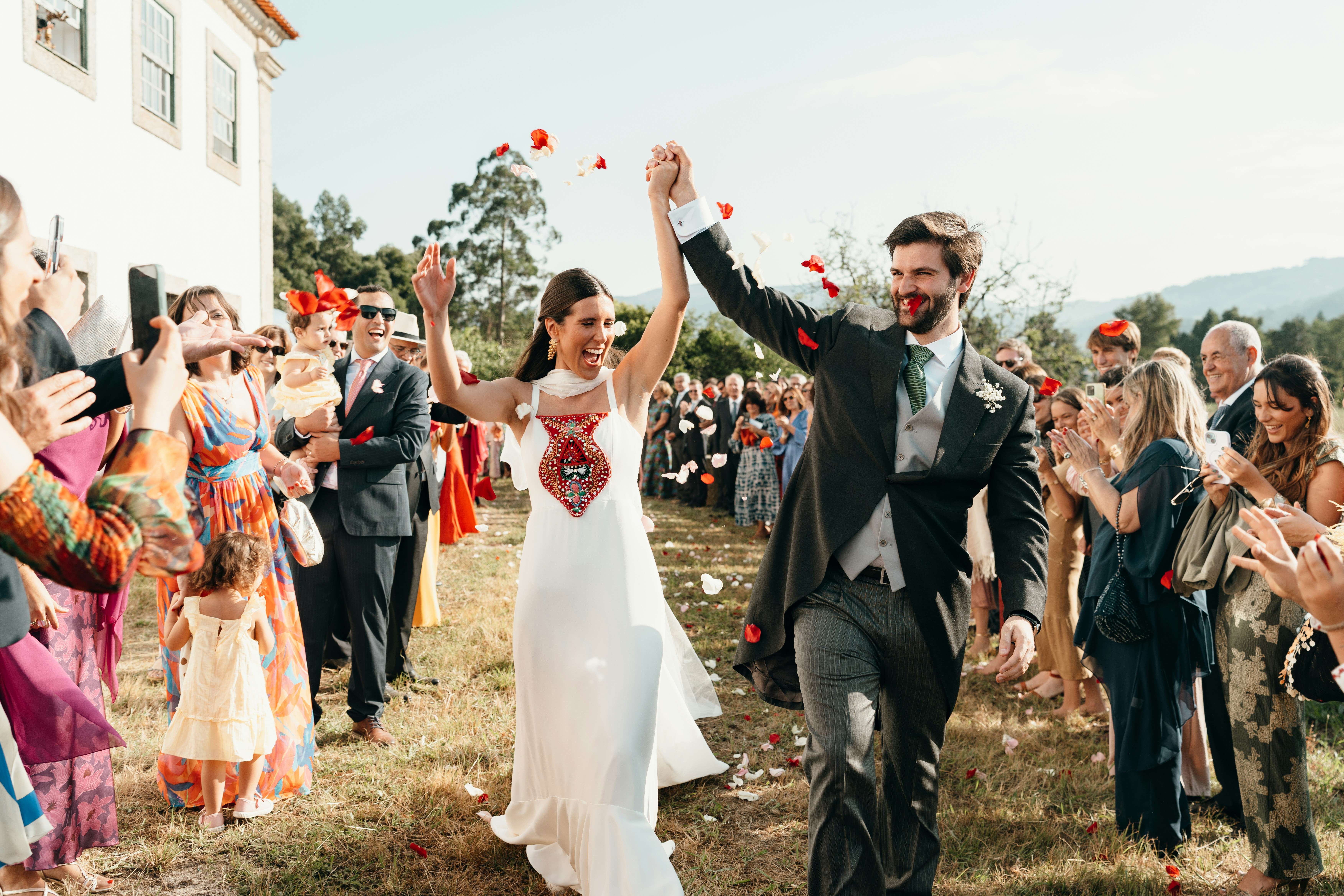 Newlyweds walk through a petal shower
