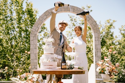 Couple toasts with champagne at outdoor wedding reception