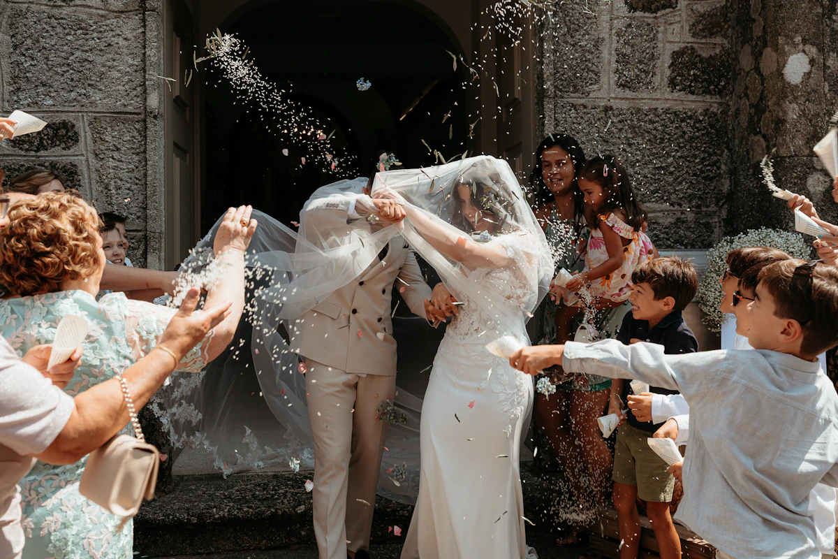 Wedding guests celebrating with confetti
