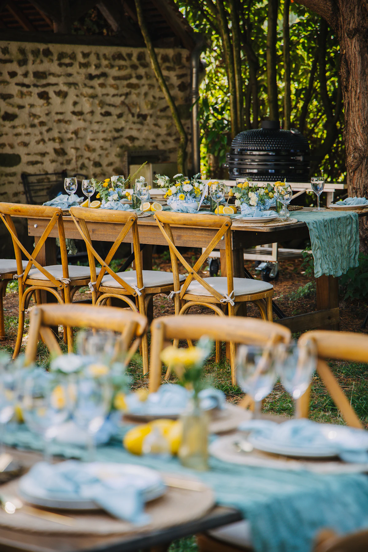 Outdoor dining table elegantly set for a rustic celebration