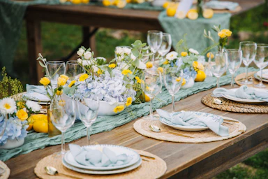 Outdoor table setting with lemons and flowers