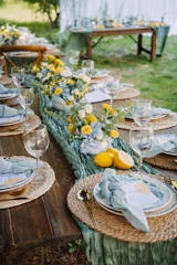 A beautifully set outdoor dining table with floral centerpiece.