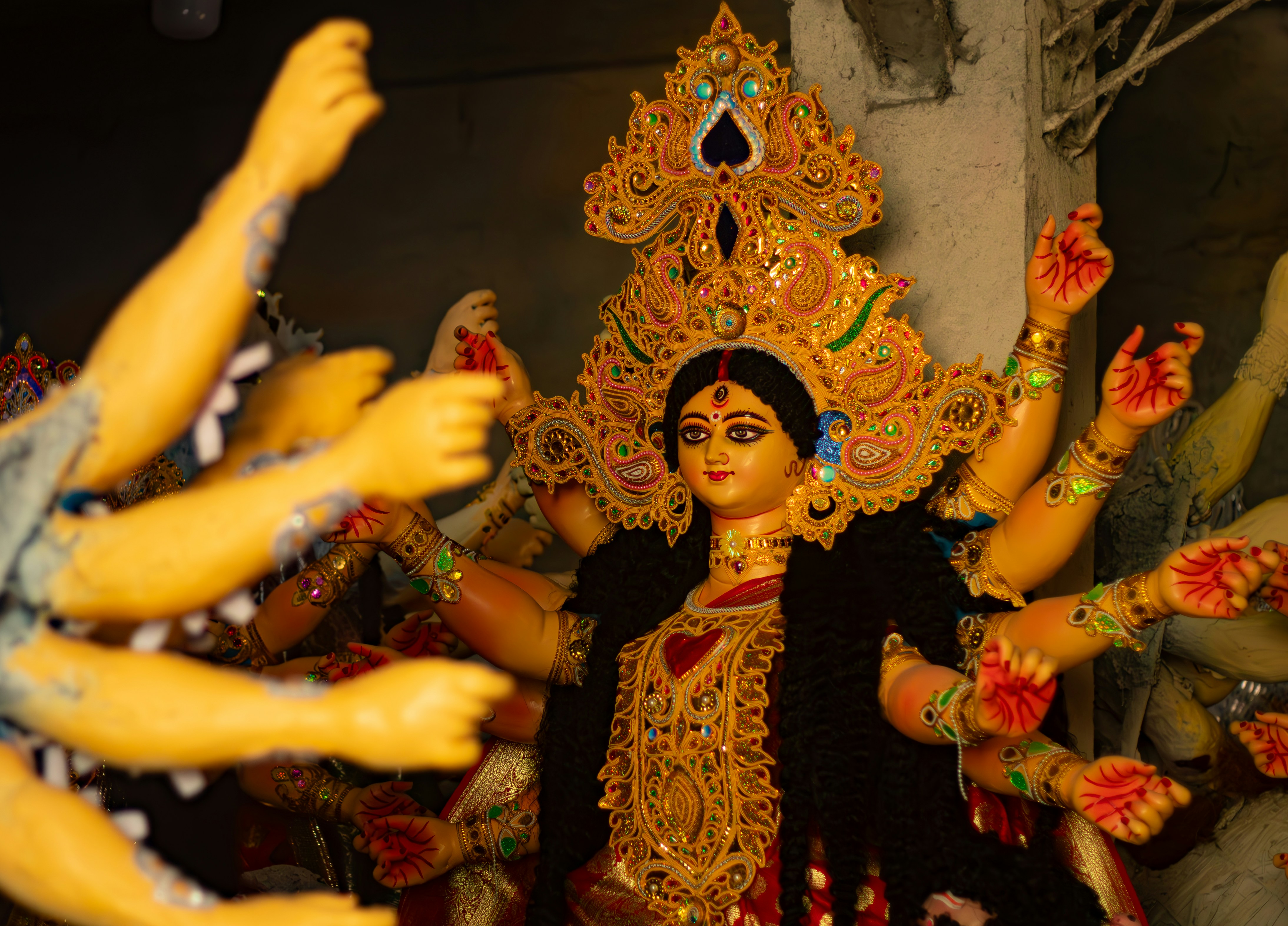 Goddess durga idol with multiple hands and ornate crown