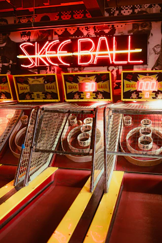 Skee-ball machines with neon sign