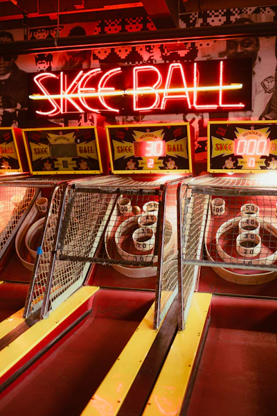 Skee-ball machines with neon sign