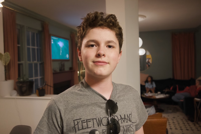 Smiling young man in grey tee