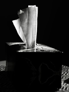 Tissues emerging from a dark box