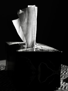 Tissues emerging from a dark box