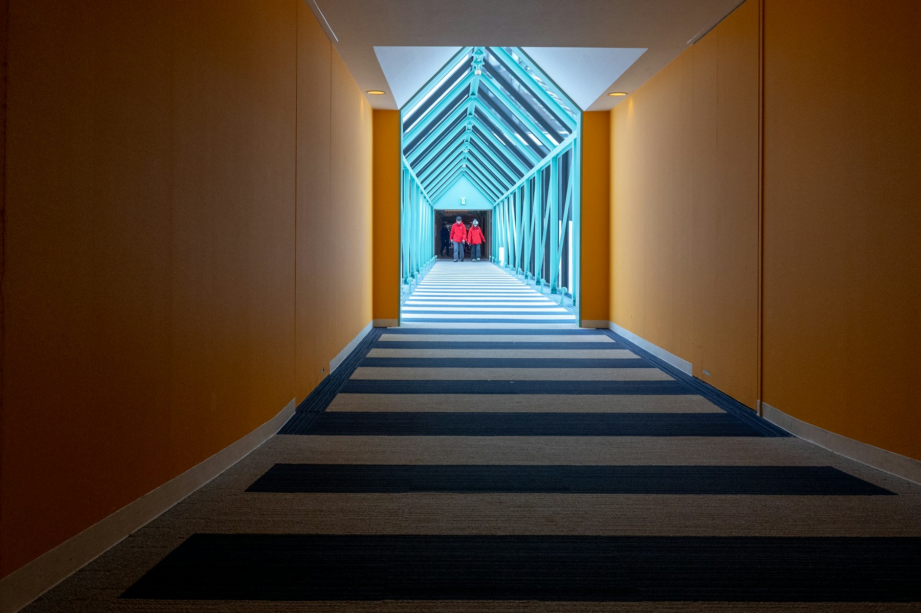 Color-blocked bands running across a corridor floor
