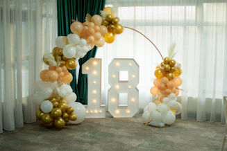 Illuminated number 18 with balloon decorations