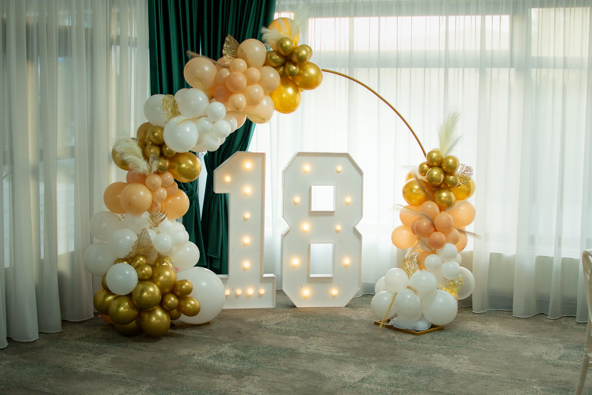 Illuminated number 18 with balloon decorations