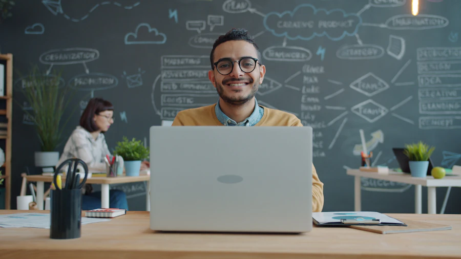 Affiliate partner smiling with a laptop