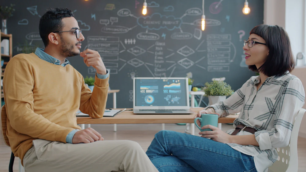 A small website team talking through a project together