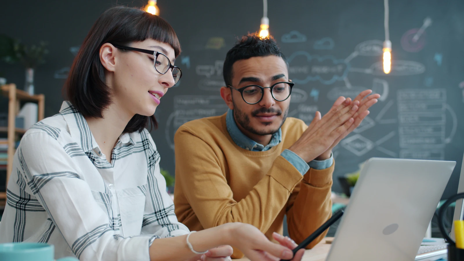 Business colleagues working with a laptop