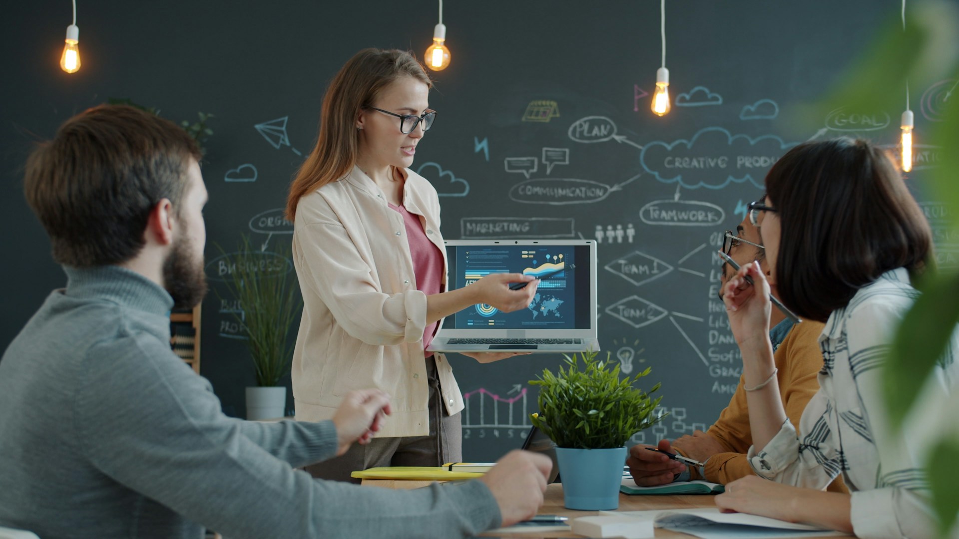 Woman presenting a business strategy to colleagues