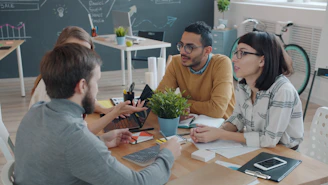 Diverse team collaborating around a table in office.