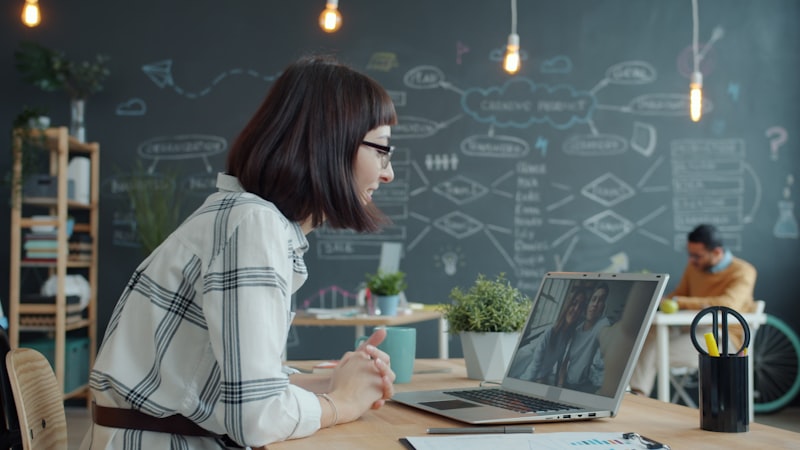 Team member on a video conference from a modern office