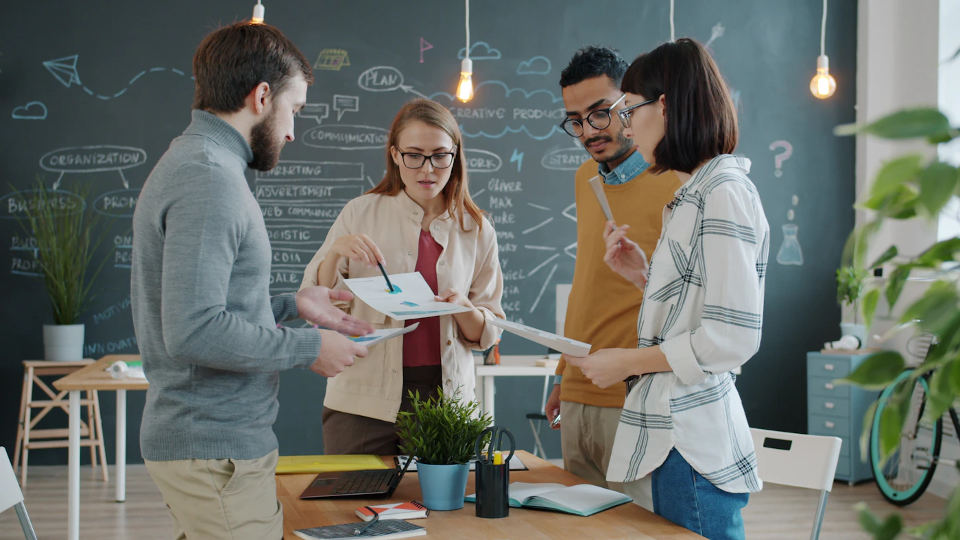 A diverse creative team working together around a shared project