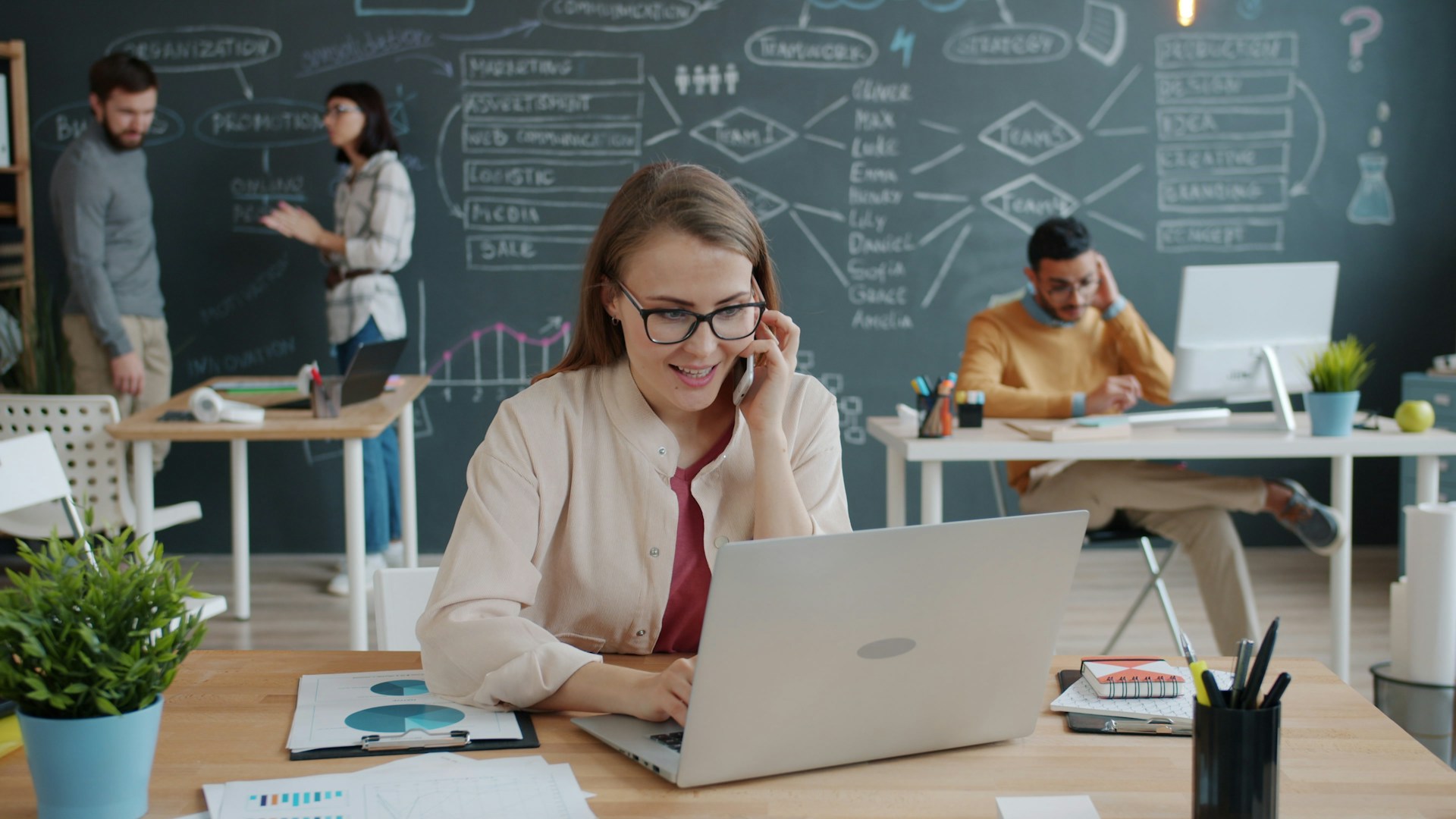 Business professionals working in a modern office environment.