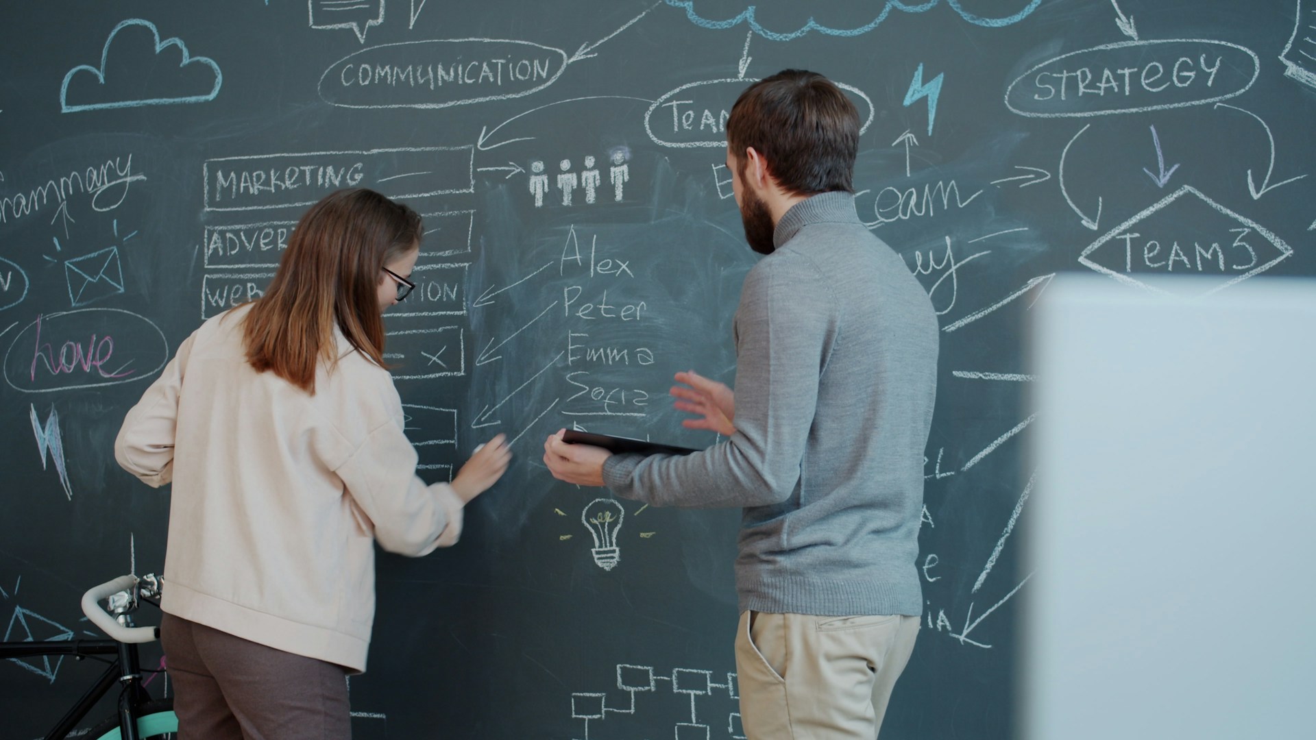 Accounting team reviewing their workflow together in an office