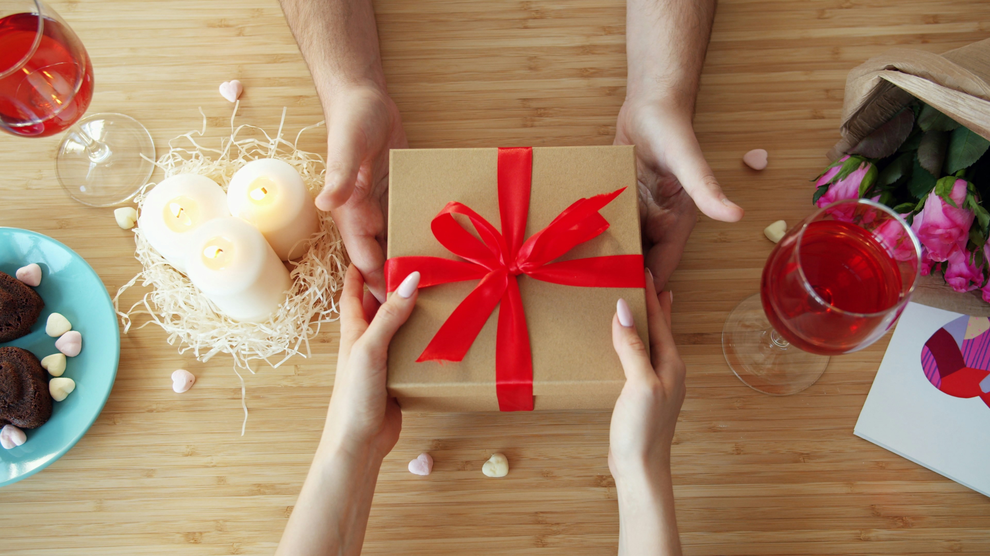 Man giving gift to woman