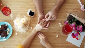 Man proposes to woman with engagement ring.