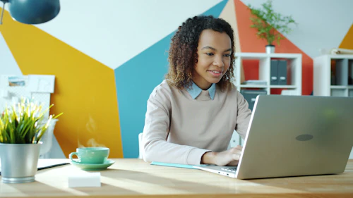 dating apps Estonia — woman messaging matches on laptop