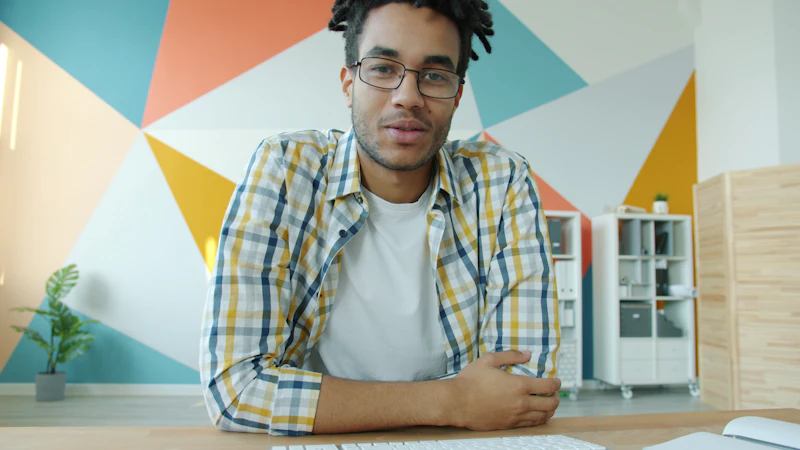 Remote worker on a video conference call from a colourful home office